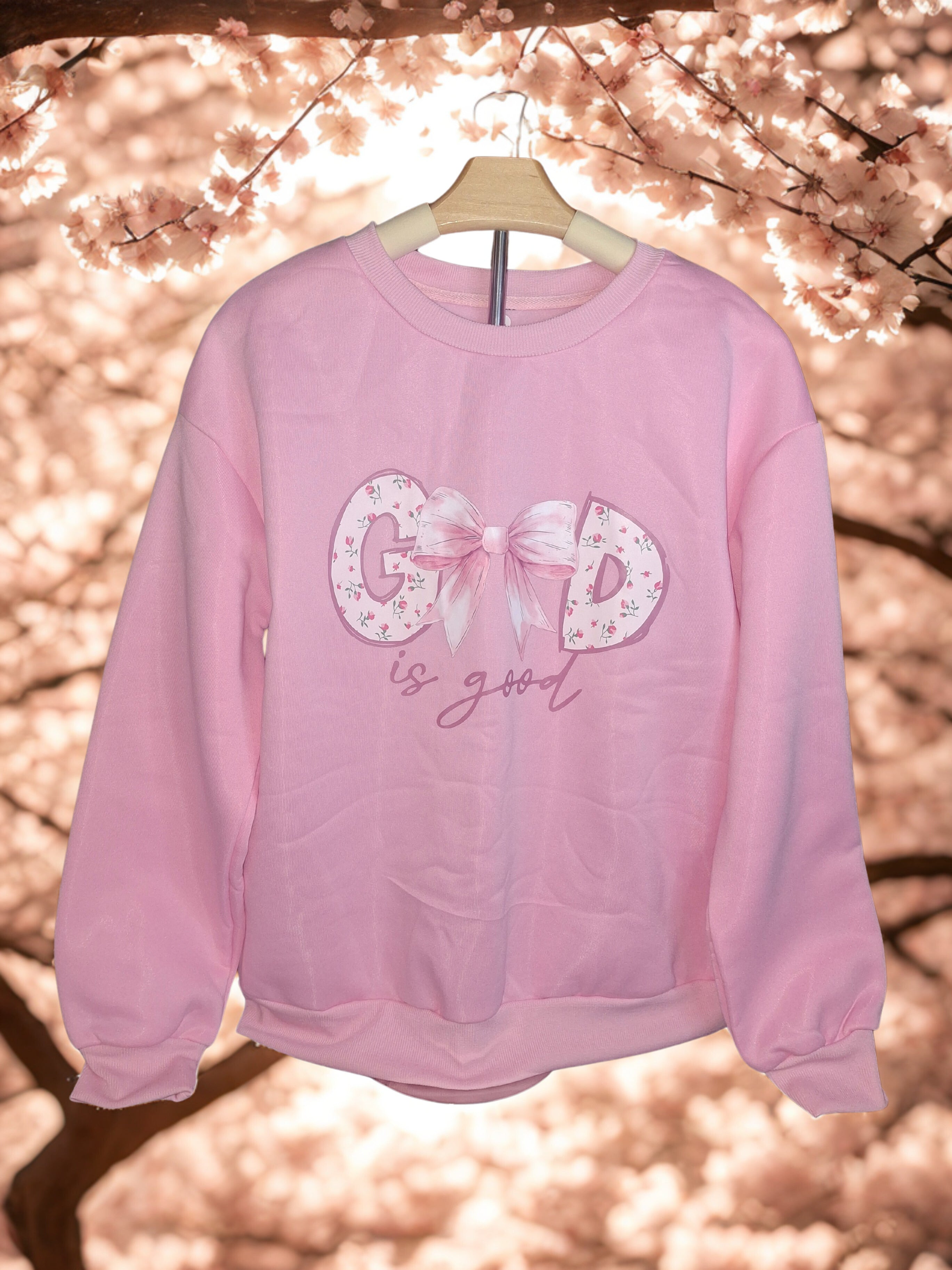 Sudadera holgada con capucha de forro polar grueso y cuello redondo para mujer, con estampado de lacito, floral menudo y la frase "Dios es bueno" más lacito para el cabello.